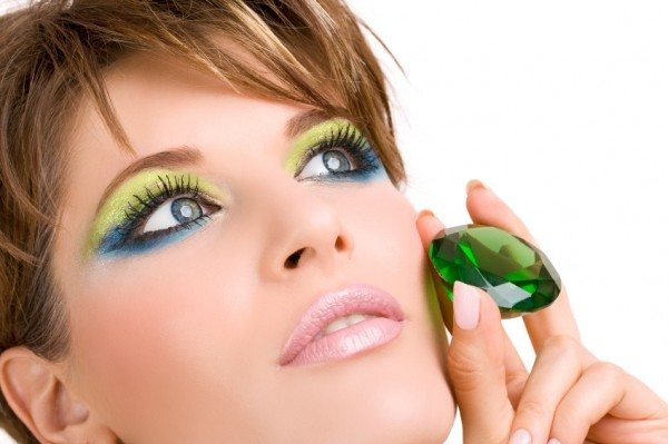 Woman with Round Emerald Gem