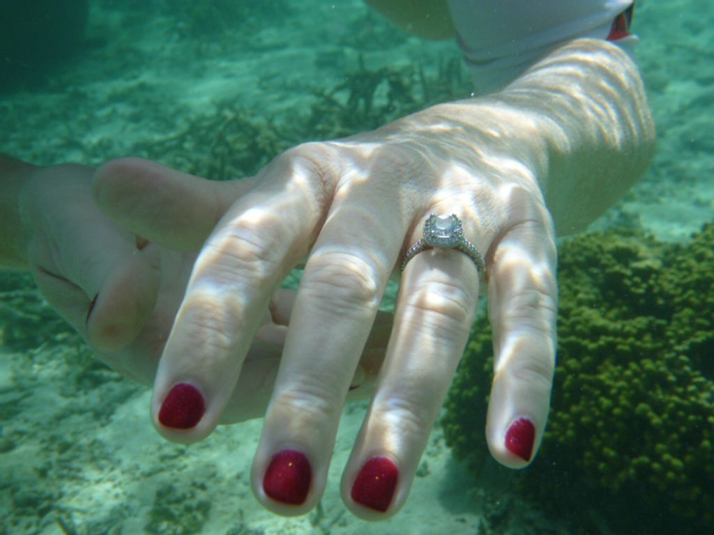 Ring in hand underwater