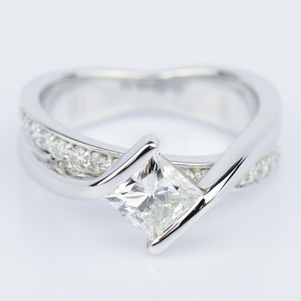 Bezel Diamond Bridge Engagement Ring featuring an E VS2 Princess Cut Diamond