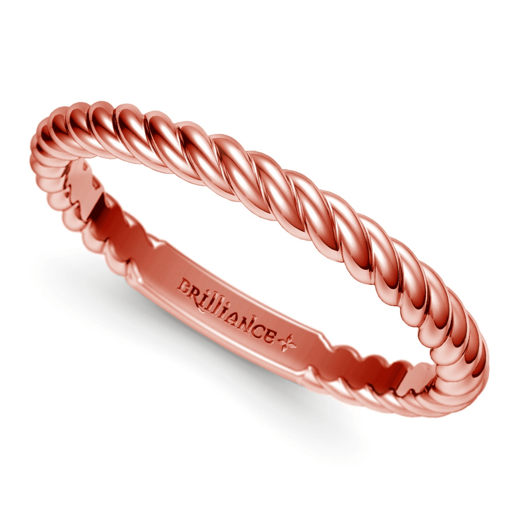 Wedding vow renewal rings for her can feature a sweet and simple twist of rose gold to complement his rugged rope design